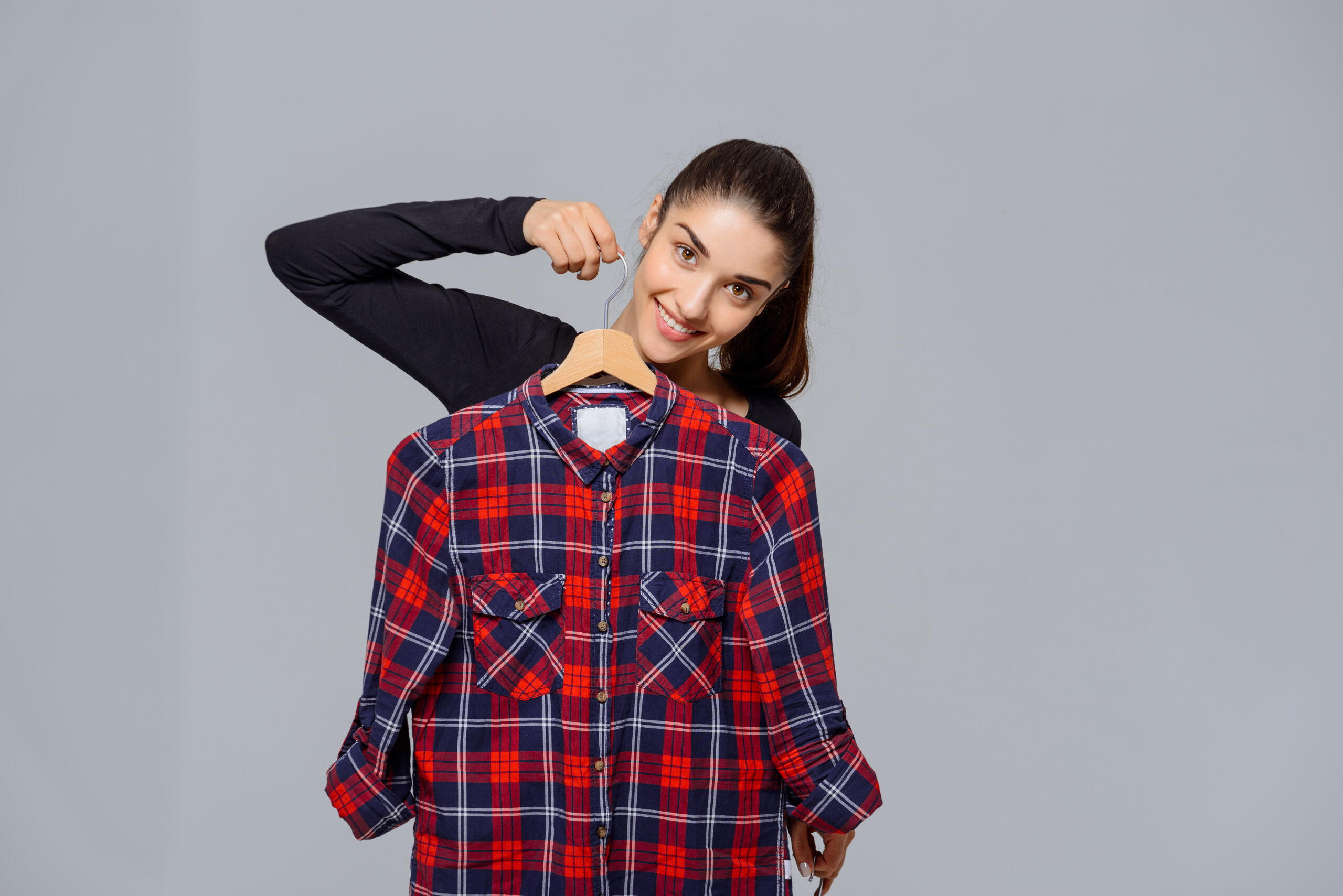 Beautiful young girl choosing what to wear